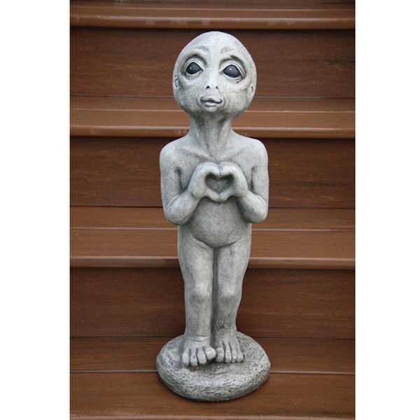Heart Alien statue featuring an extraterrestrial figure with a hand shaped